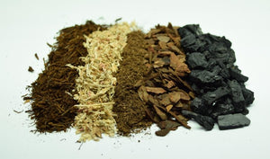 Close up of Atlanta Botanical Gardens Terrarium Soil Ingredients; tree fern fiber, sphagnum moss, sphagnum peat moss, bark chips, charcoal.